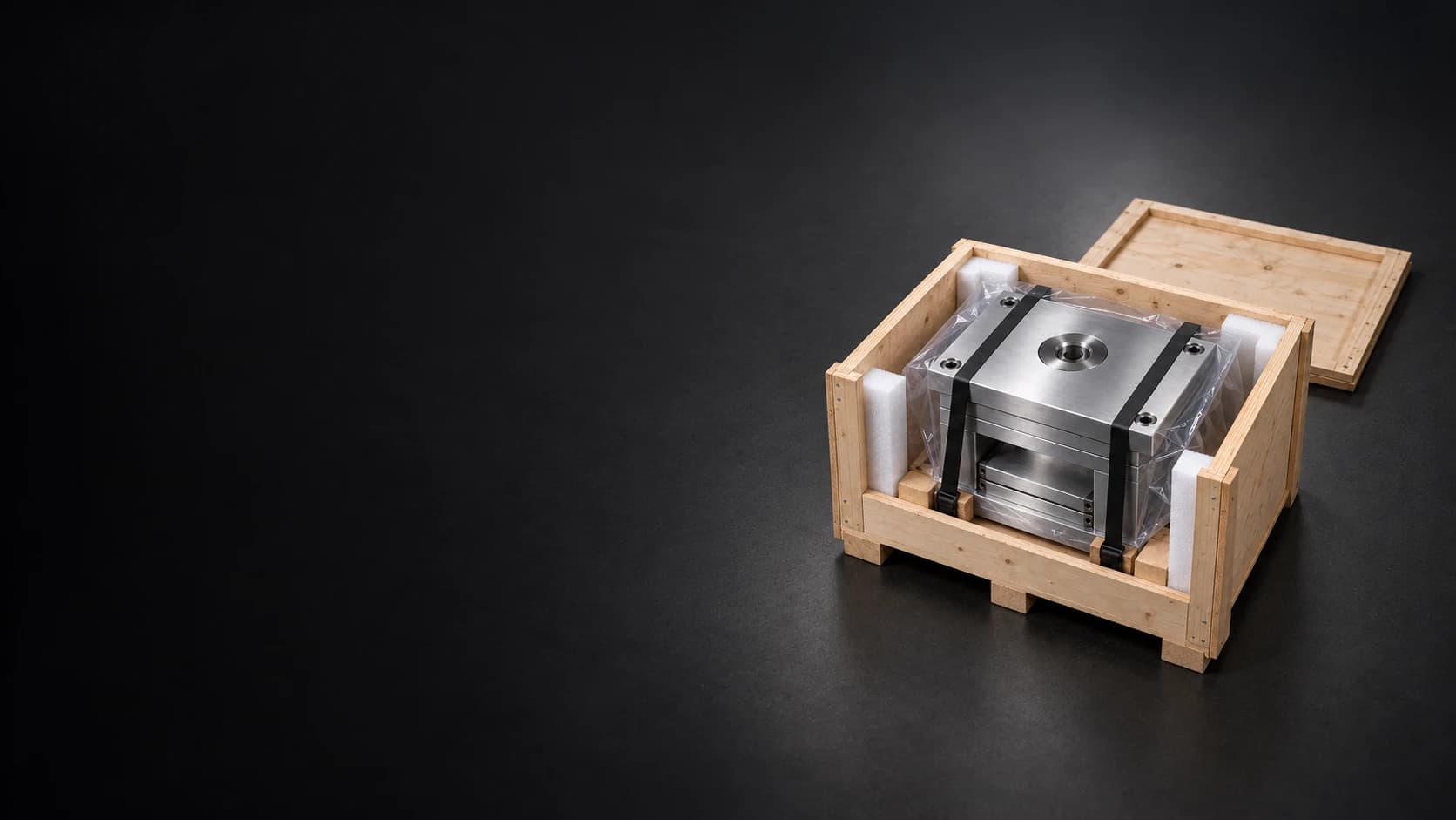 Complete wooden shipping crate with a wrapped and strapped mold base on a dark graphite floor